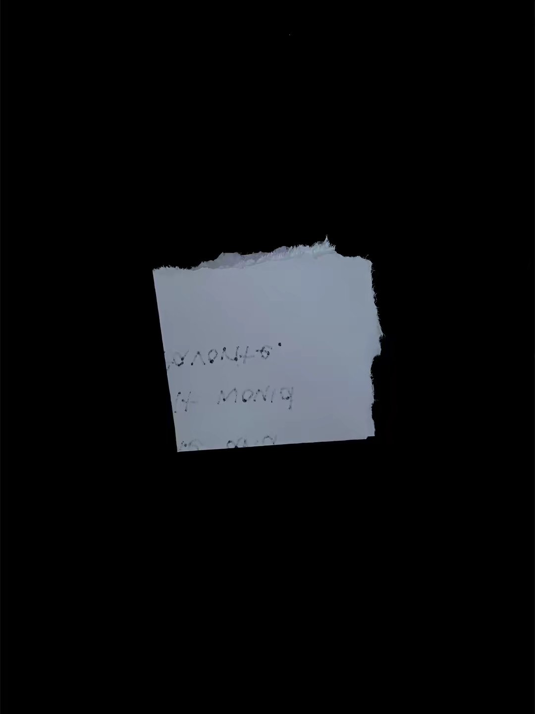 Unreadable partial handwritten note fragment